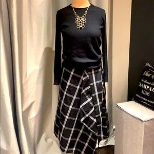 A-line midi skirt with front fold detail.